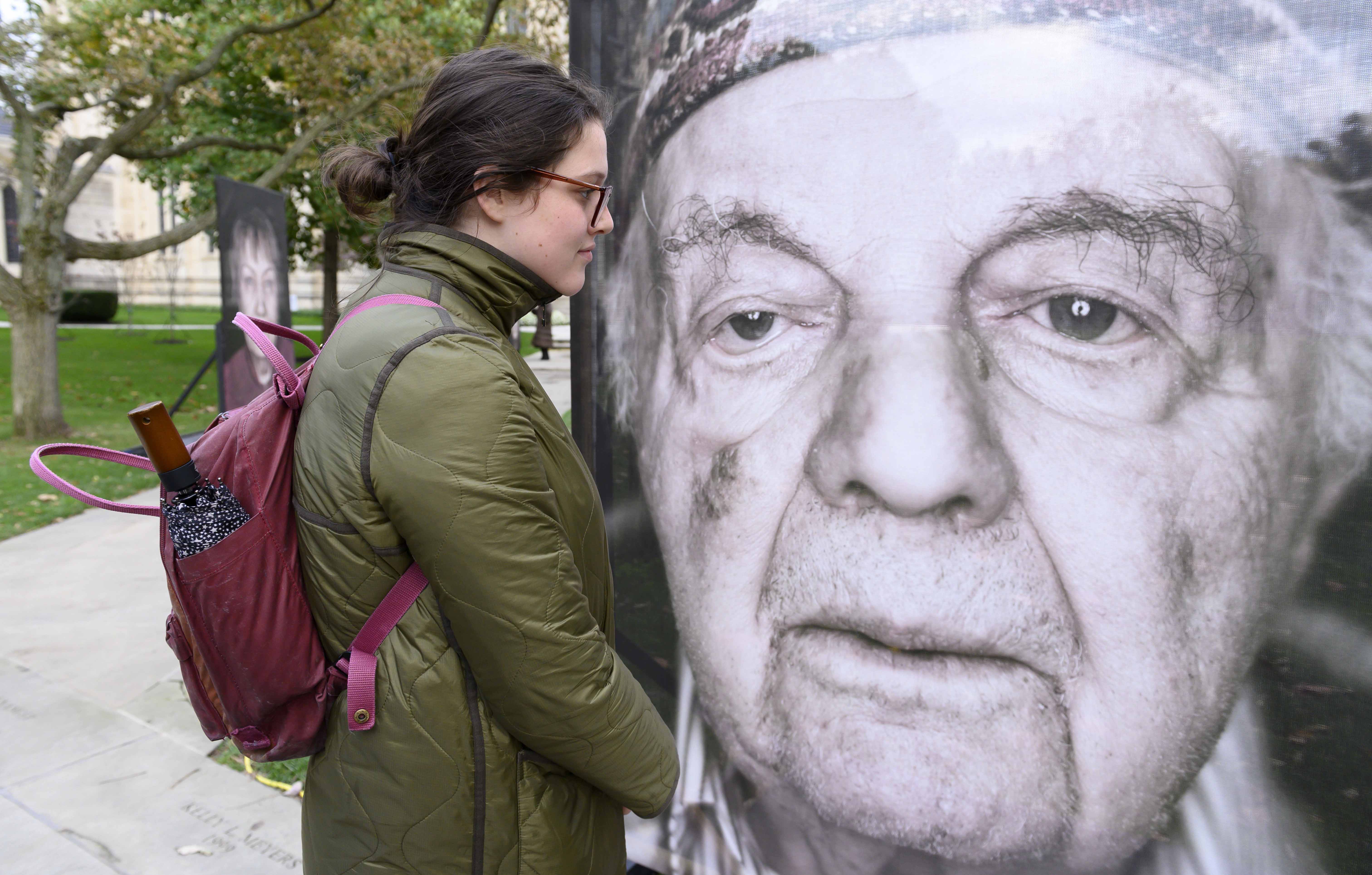 Student looking at Holocaust survivor photo