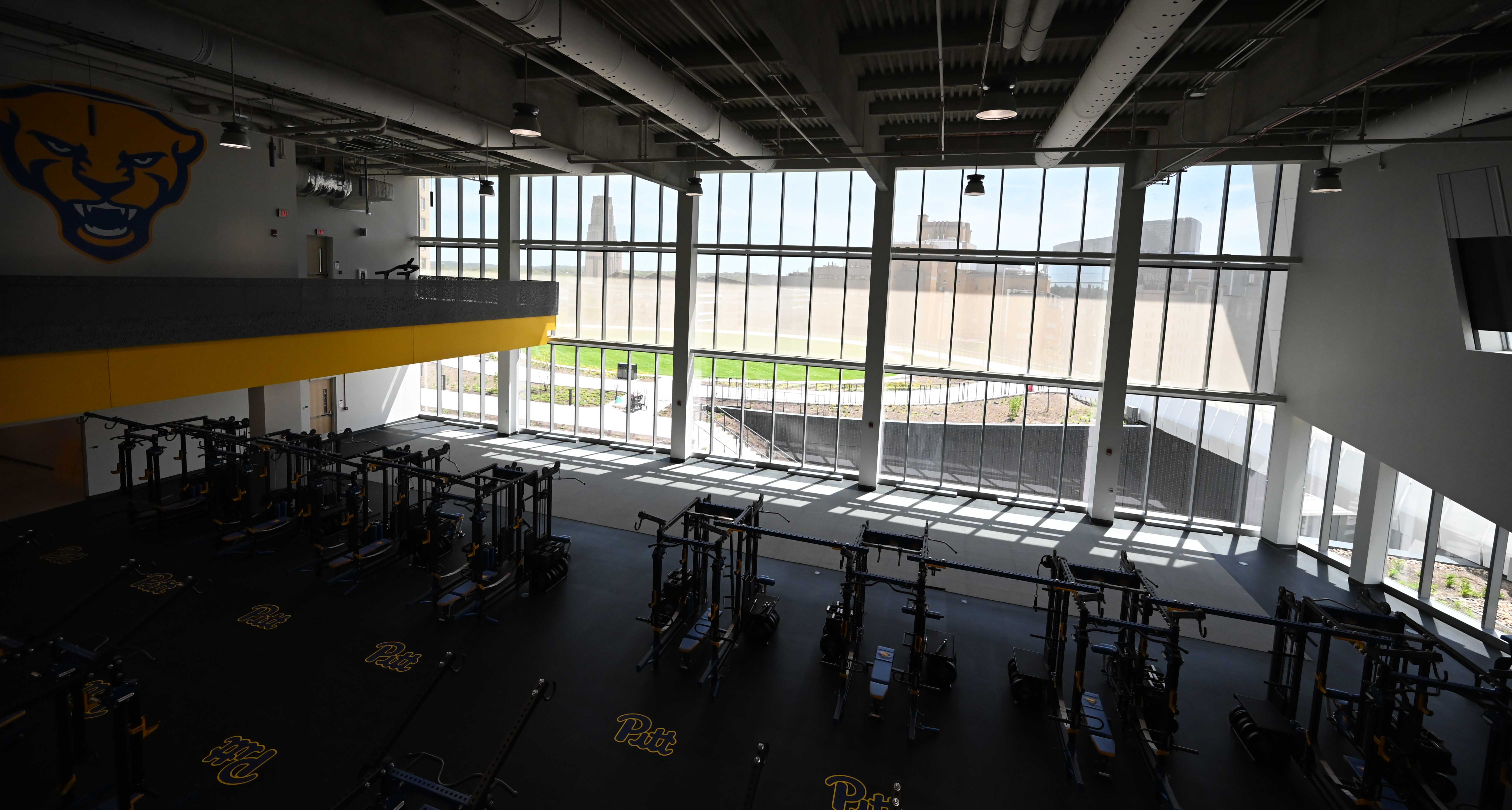 The view from the balcony overlooking the Martchek Family Strength and Conditioning Center has a spectacular view of the campus beyond. (Photos by Aimee Obidzinski | University of Pittsburgh)