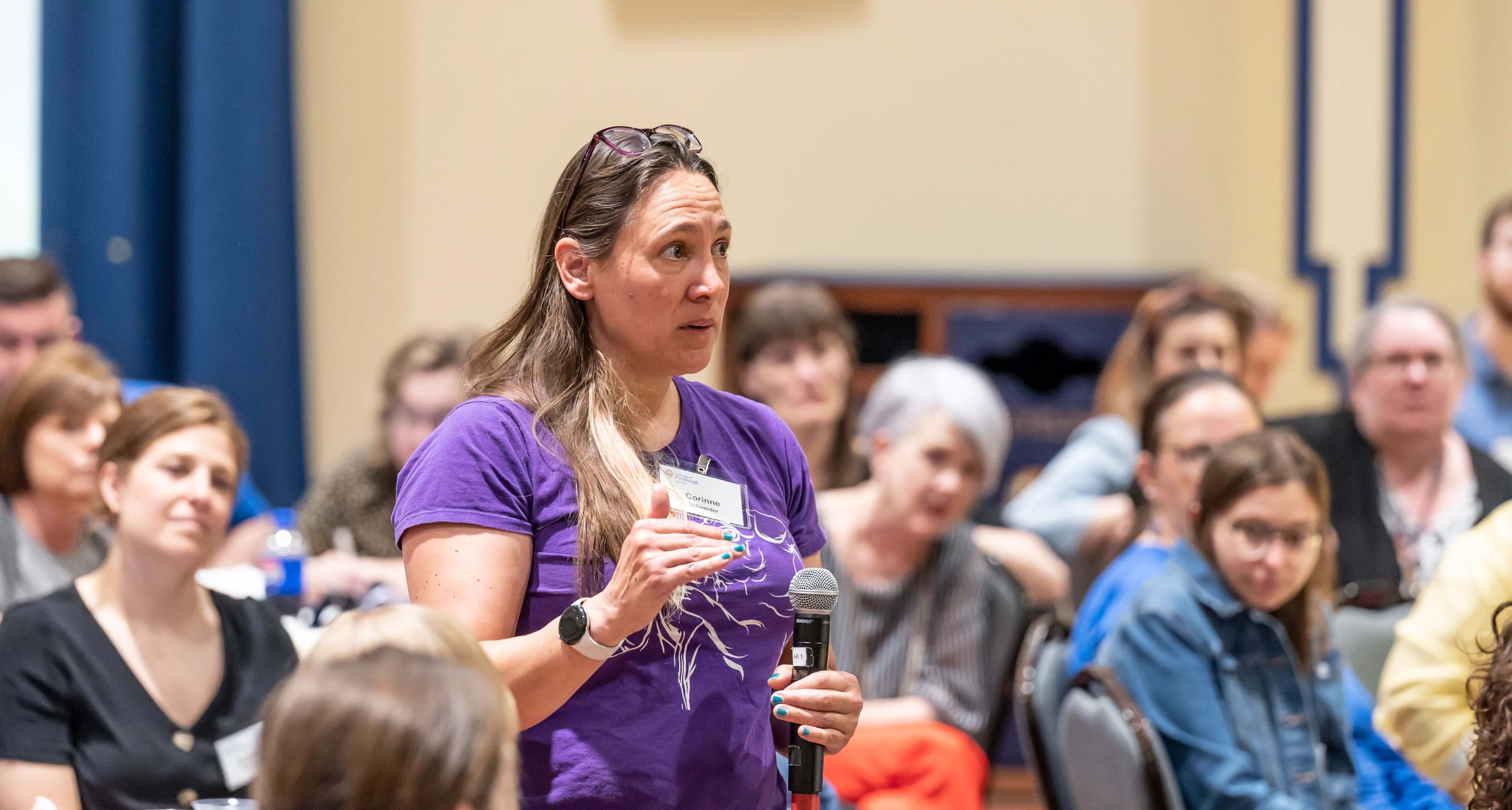 A staff member asks questions during the Staff Council Spring Assembly on May 8. (Aimee Obidzinski | University of Pittsburgh)