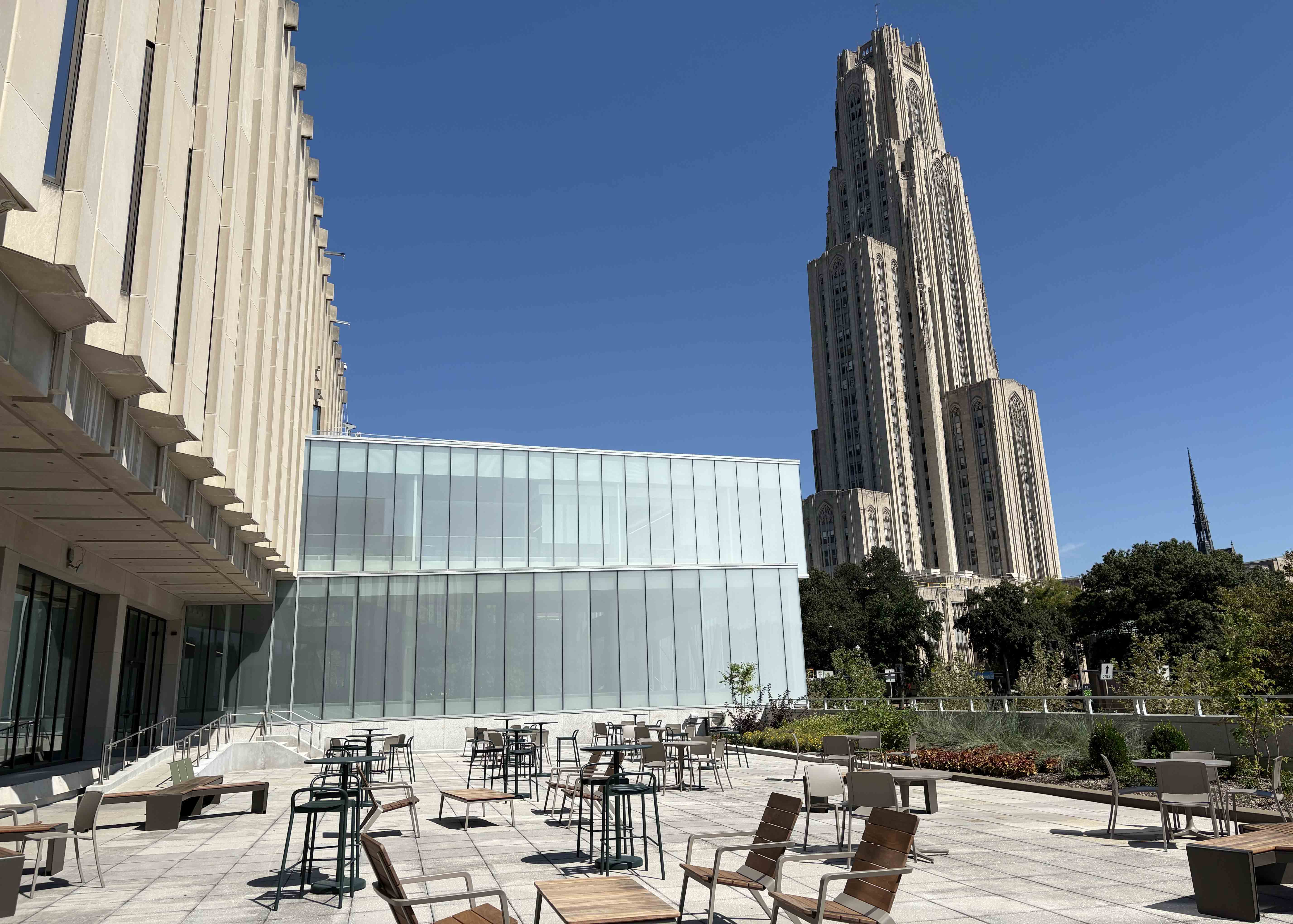 A patio accessed through Hillman Library's first floor gives a view of the new and old parts of the building. (Photos by Susan Jones | University Times) Patio outside library