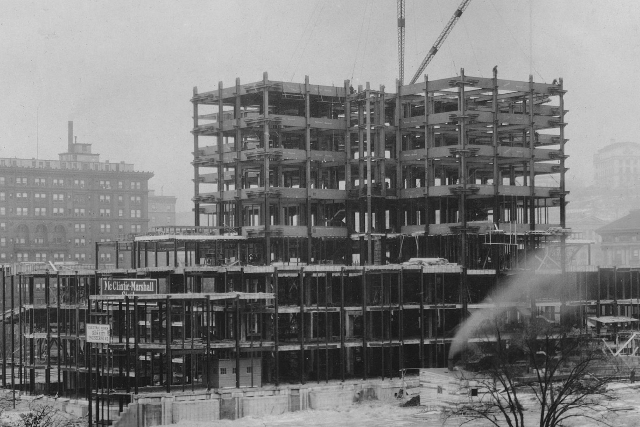 View of construction progress of the Cathedral of Learning, from the administration building. The University of Pittsburgh's Cathedral of Learning, championed by Chancellor John Bowman, was built from 1926-1936 and dedicated in 1937. (University of Pittsburgh archives)