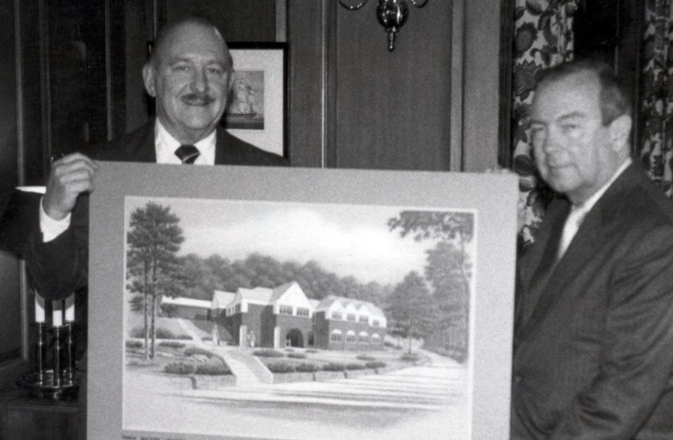 George F. Chambers (left) and John A. Robertshaw Jr. with an architectural drawing for a new Pitt–Greensburg faculty office building in 1987. (Pitt Archives) Two men holding drawing