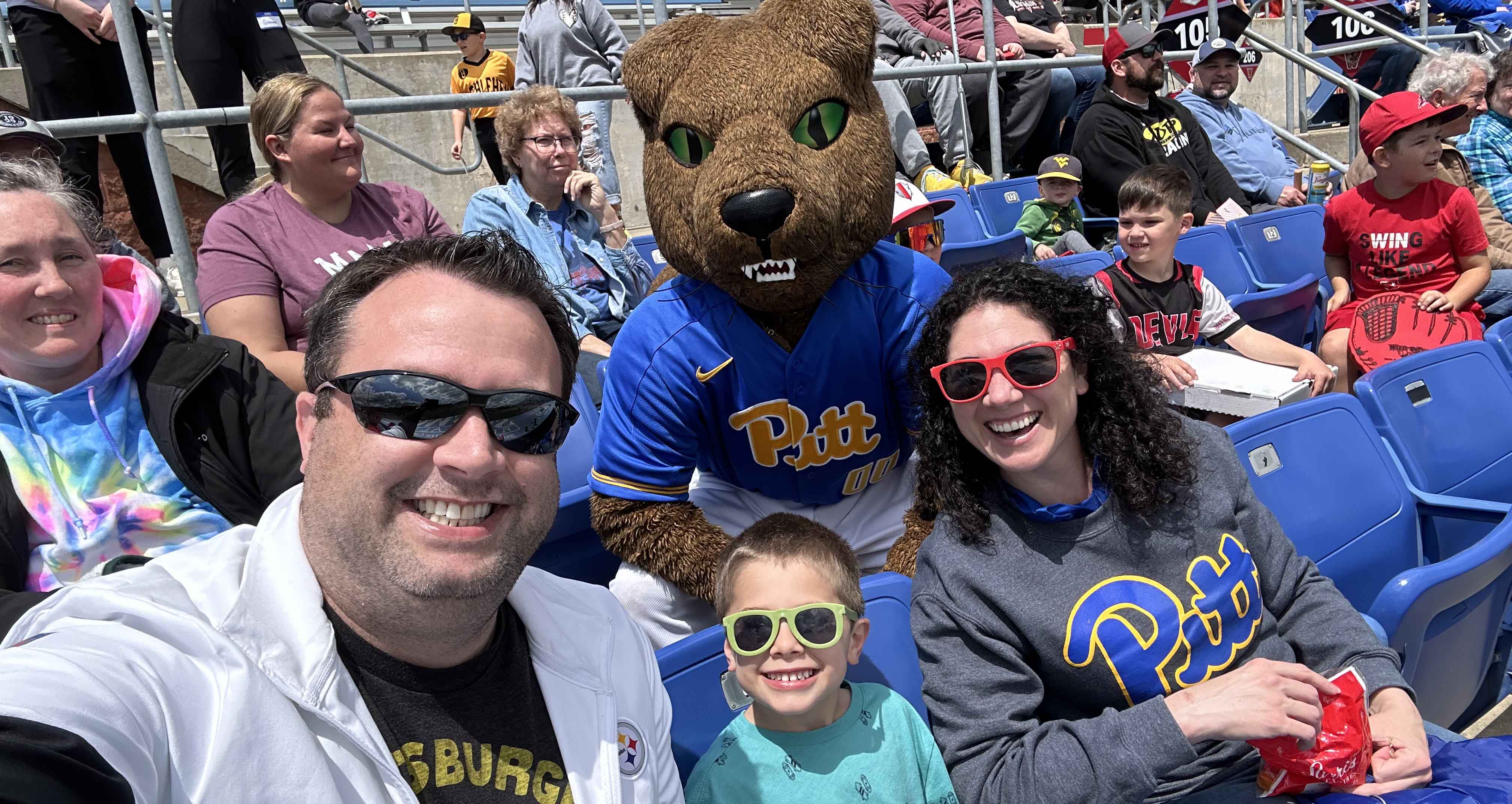 Lauren Panetti with her husband and son, Dan and Henry Quindlen, and a special guest.. Three people and Roc