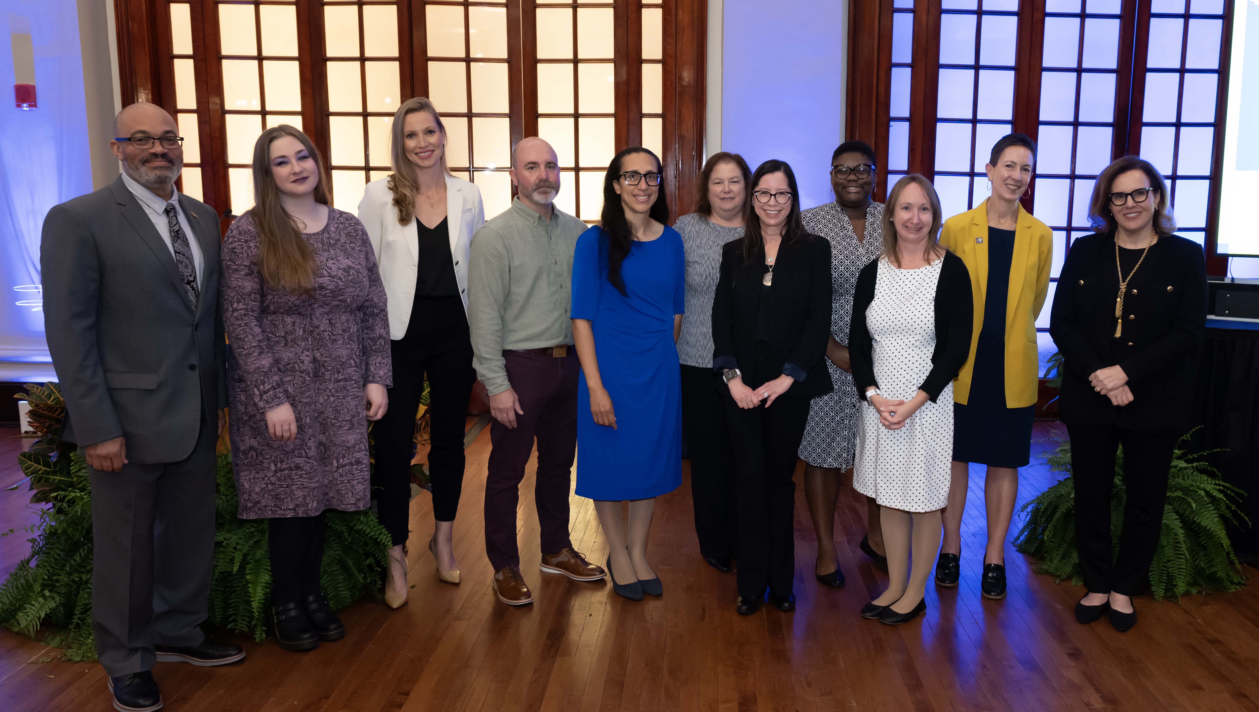 James Gallaher (left), vice chancellor for human resources, and Chancellor Joan Gabel (right) were on hand to congratulate the winners of the Chancellor’s Staff Awards. The awardees are (from left) Miranda Acosta, Laura Kingsley, Brandon Barber, Kelly Gilliam, Jean Barone, Doreen Hernandez, Anastasia White, Christine Jackson and Pat Cercone. (Aimee Obidzinski | University of Pittsburgh) Group of staff awardees