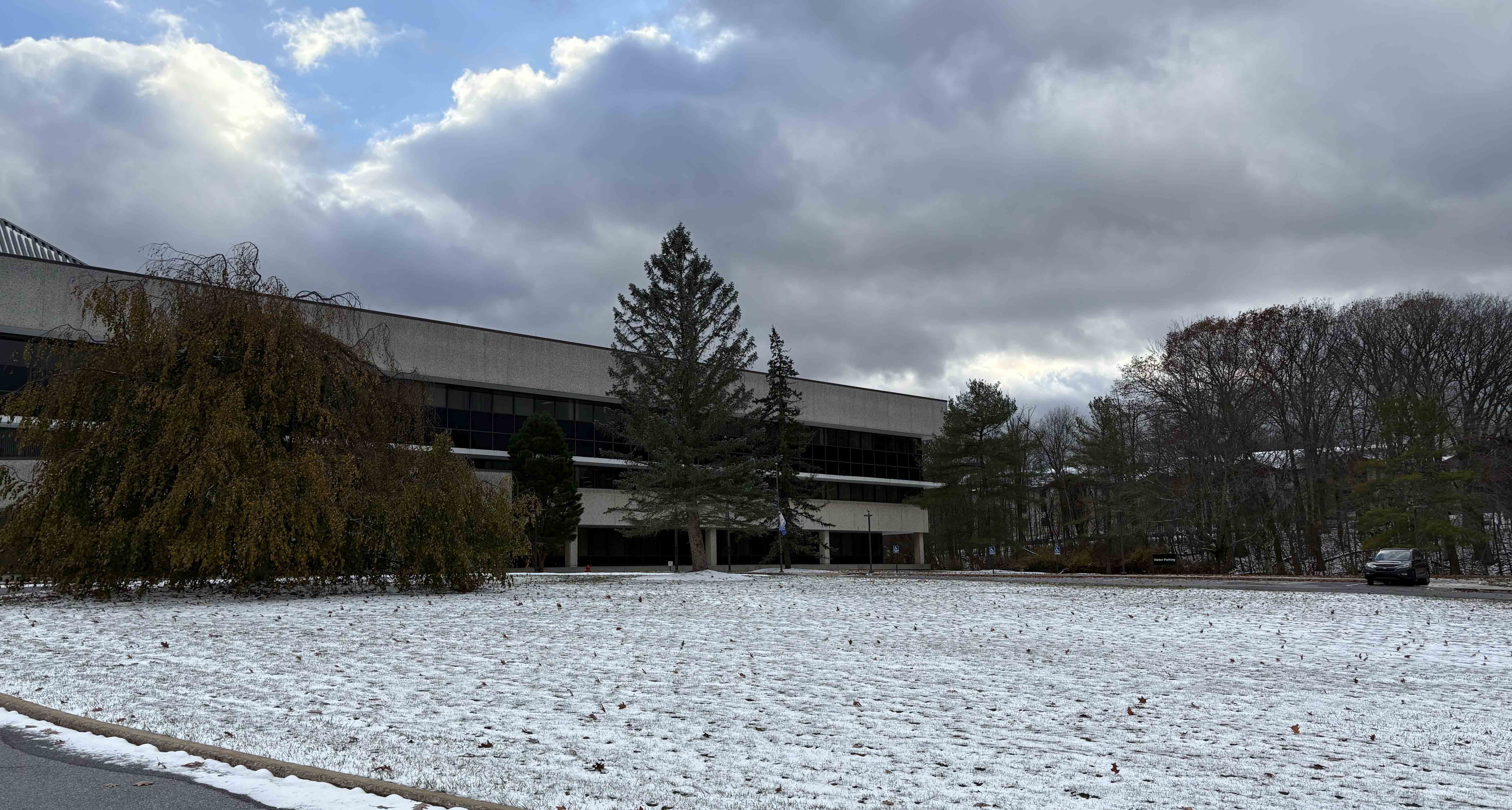 The main Pitt–Johnstown campus can be seen through the trees from the new Musulin University Center, which was acquired earlier this year from Met Life. (Susan Jones | University Times)