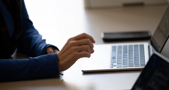 Stock photo of person at laptop